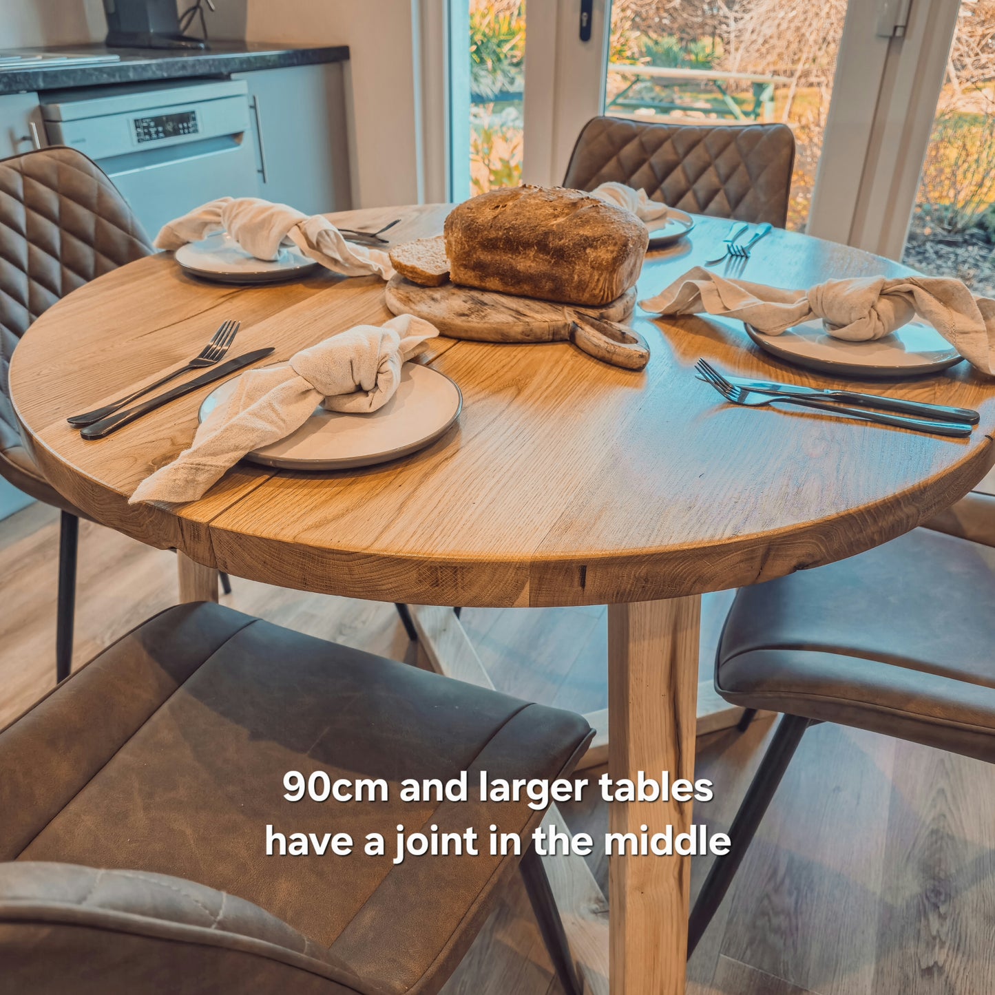 Solid Oak Round Dining Table With Wooden Legs and Leather Chairs