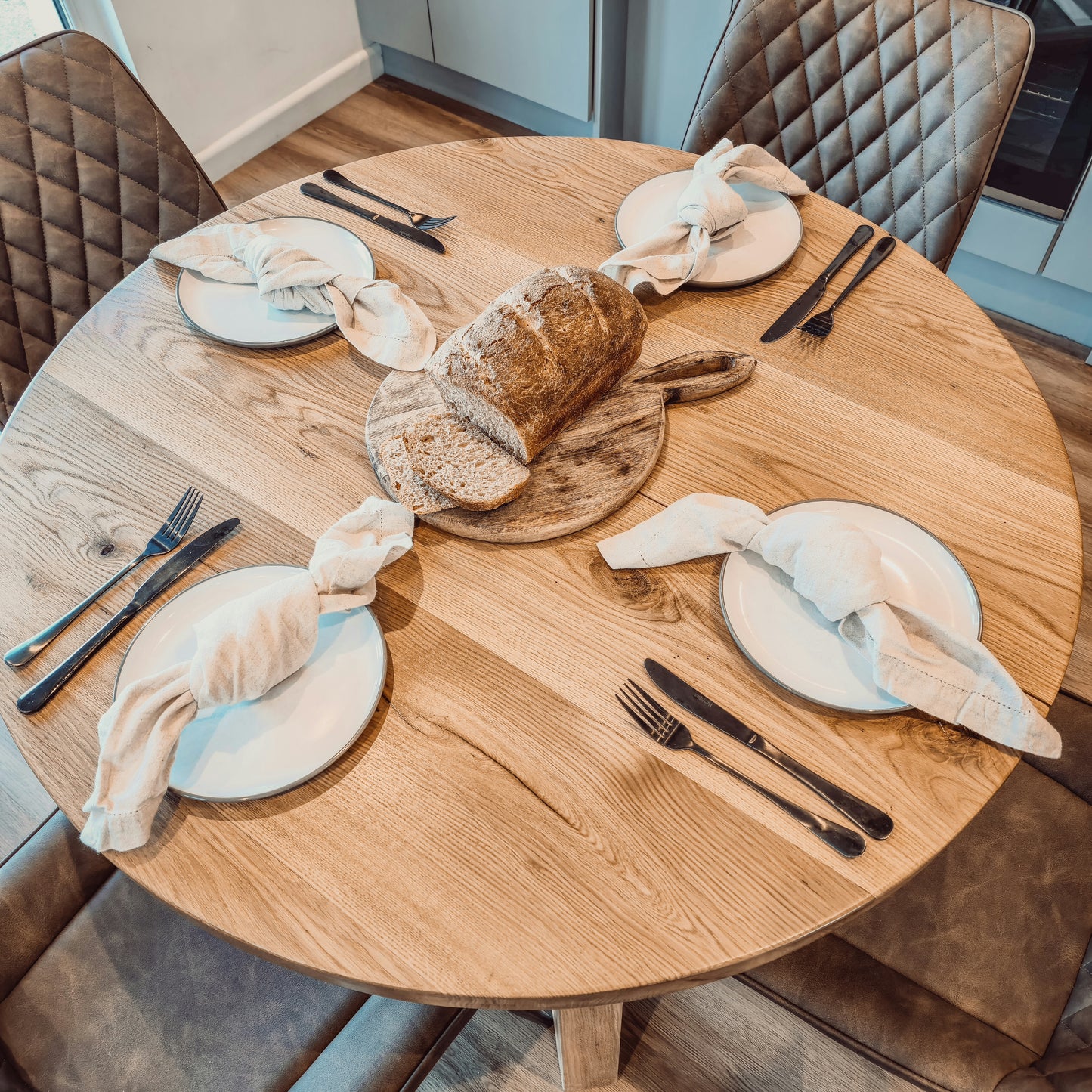 Solid Oak Round Dining Table With Wooden Legs and Leather Chairs