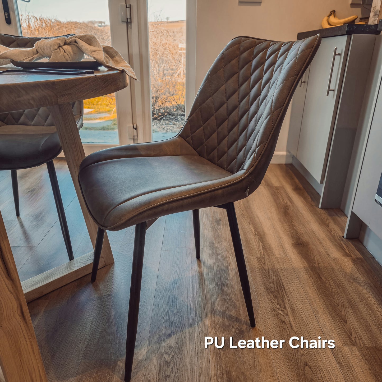 Solid Oak Round Dining Table With Wooden Legs and Leather Chairs